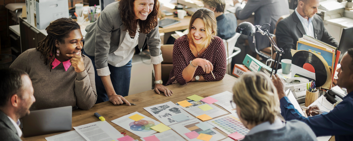 Team-Collaborates-Around-Table