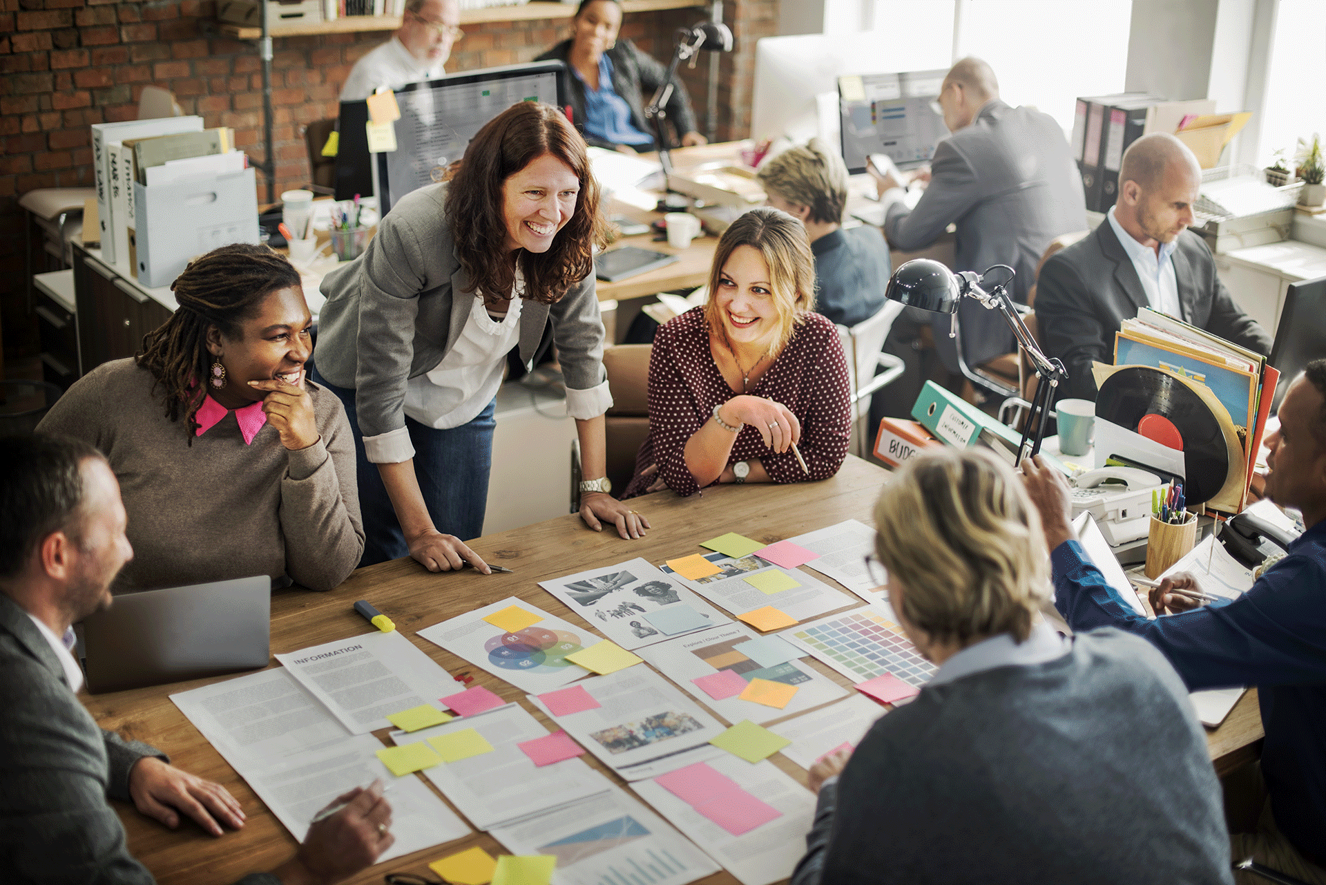 Team-Collaborates-Around-Table