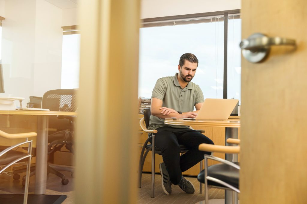 Man working on laptop at his desk