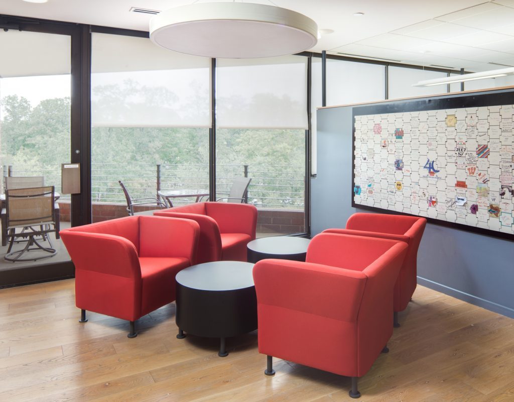 Set of red chairs in an office workspace